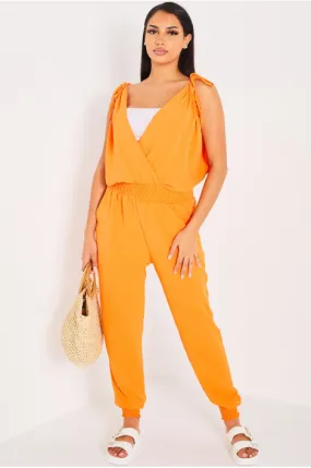 Fluid Orange Jumpsuit with Knotted Sleeves