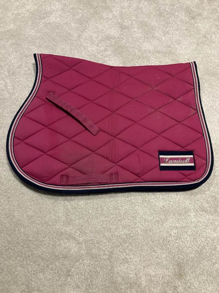 Pink LAMICELL saddle pad set with matching FOUGANZA bonnet and saddle pad.